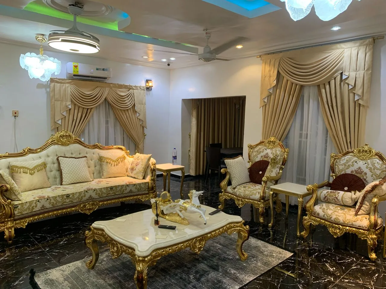 Living room makeover, swag curtains and gold suite