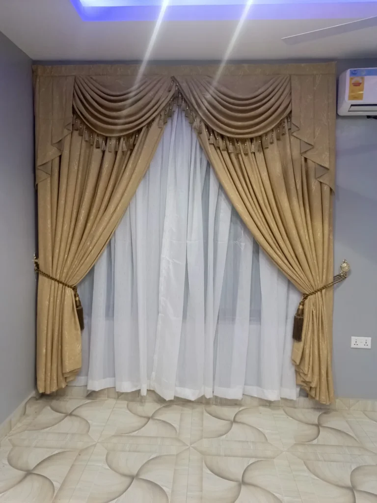 Swag and tail curtains with tasselled valance