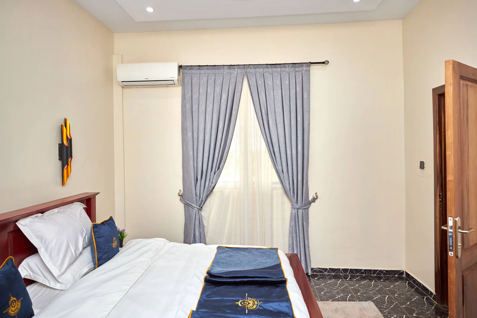 Pinch-pleat curtains with tie-backs