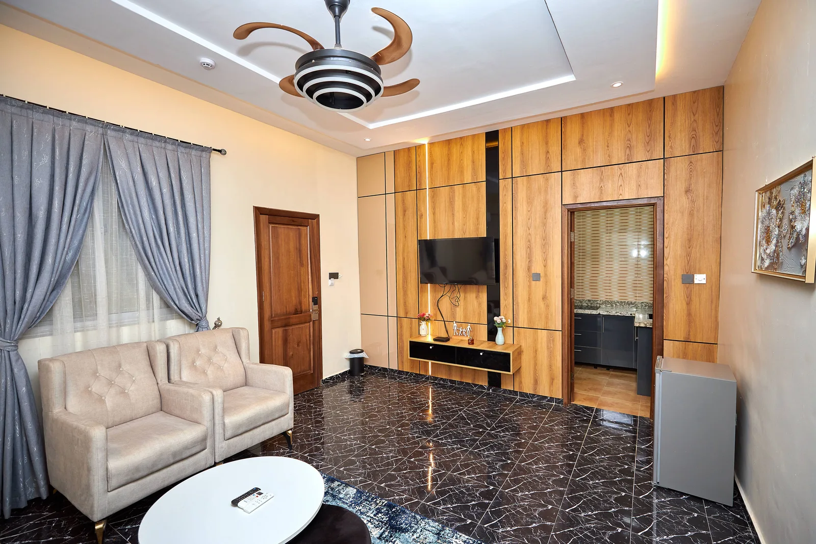 Suite lounge with full wood panel wall