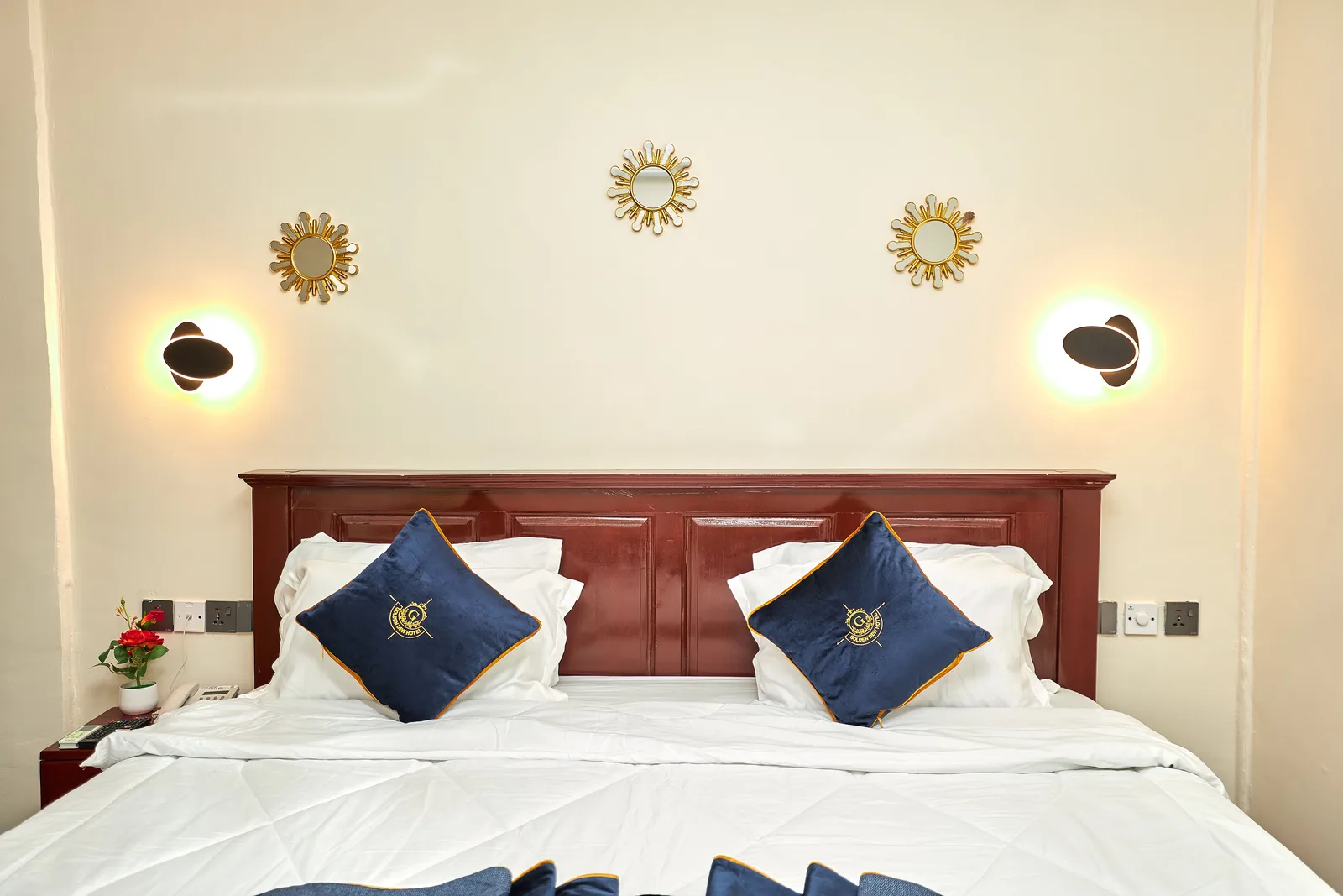 Headboard with branded cushions