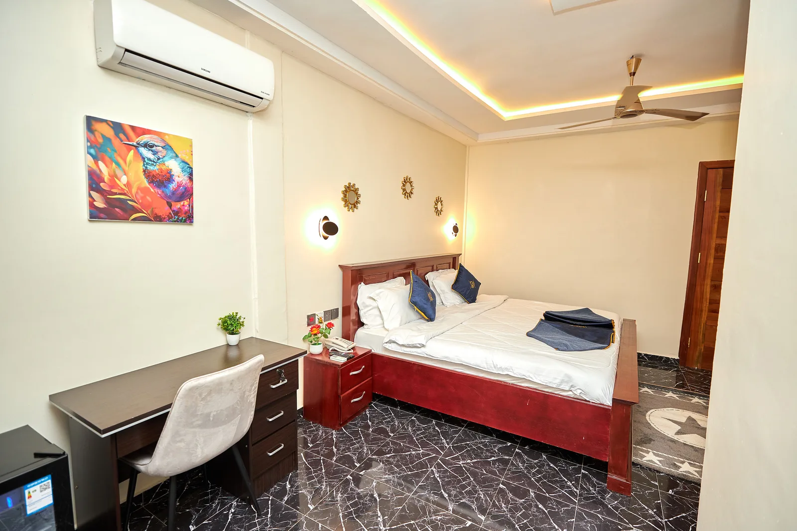 Guest room with wall lights and mirrors