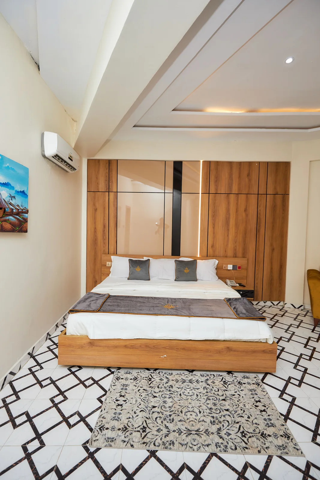 Bedroom with full-height wood panel wall and LED strip