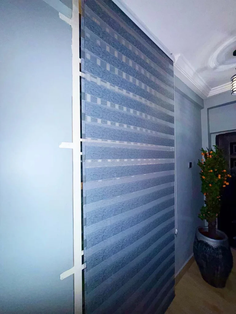 Best Interior Designers in Kumasi, Full-height zebra blind in a hallway